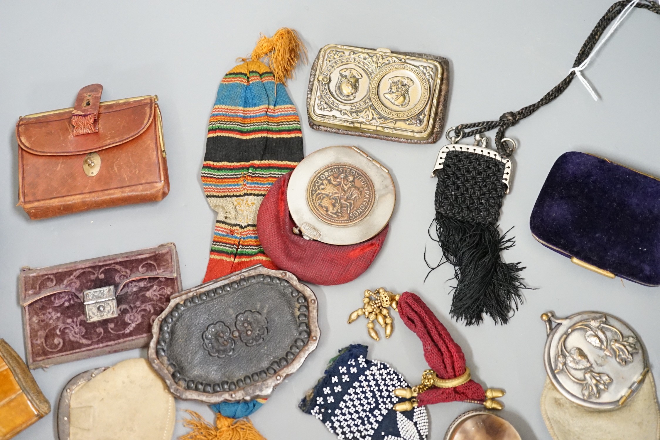 Mixed collection of mainly 19th century leather purses of various sizes and shapes, including two novelty ‘owl’ purses, a horse shoe shaped silver framed purse, cut steel purses, approx 39 in total